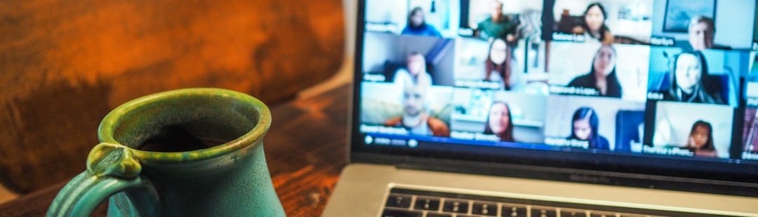 macbook pro displaying group of people