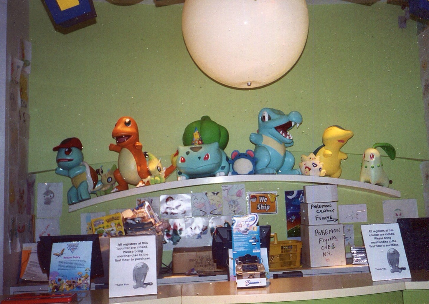 A photograph of one of the checkouts in the Pokémon Center New York, featuring a selection of starter Pokémon from the series.