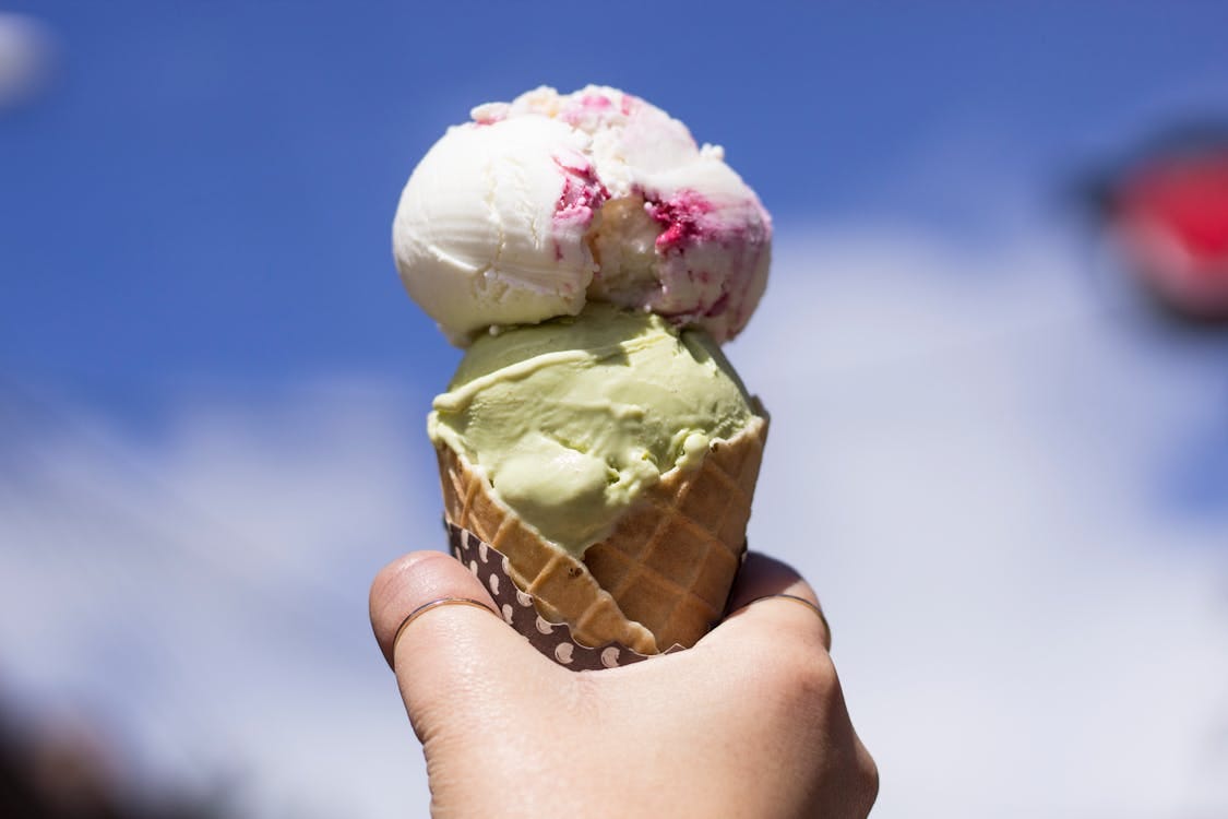 Free Person Holding Ice Cream With Cone Stock Photo