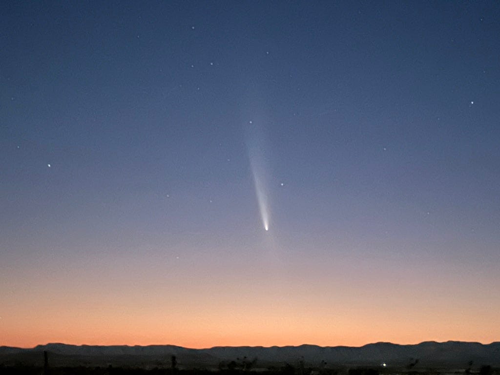 A comet in the sky

Description automatically generated