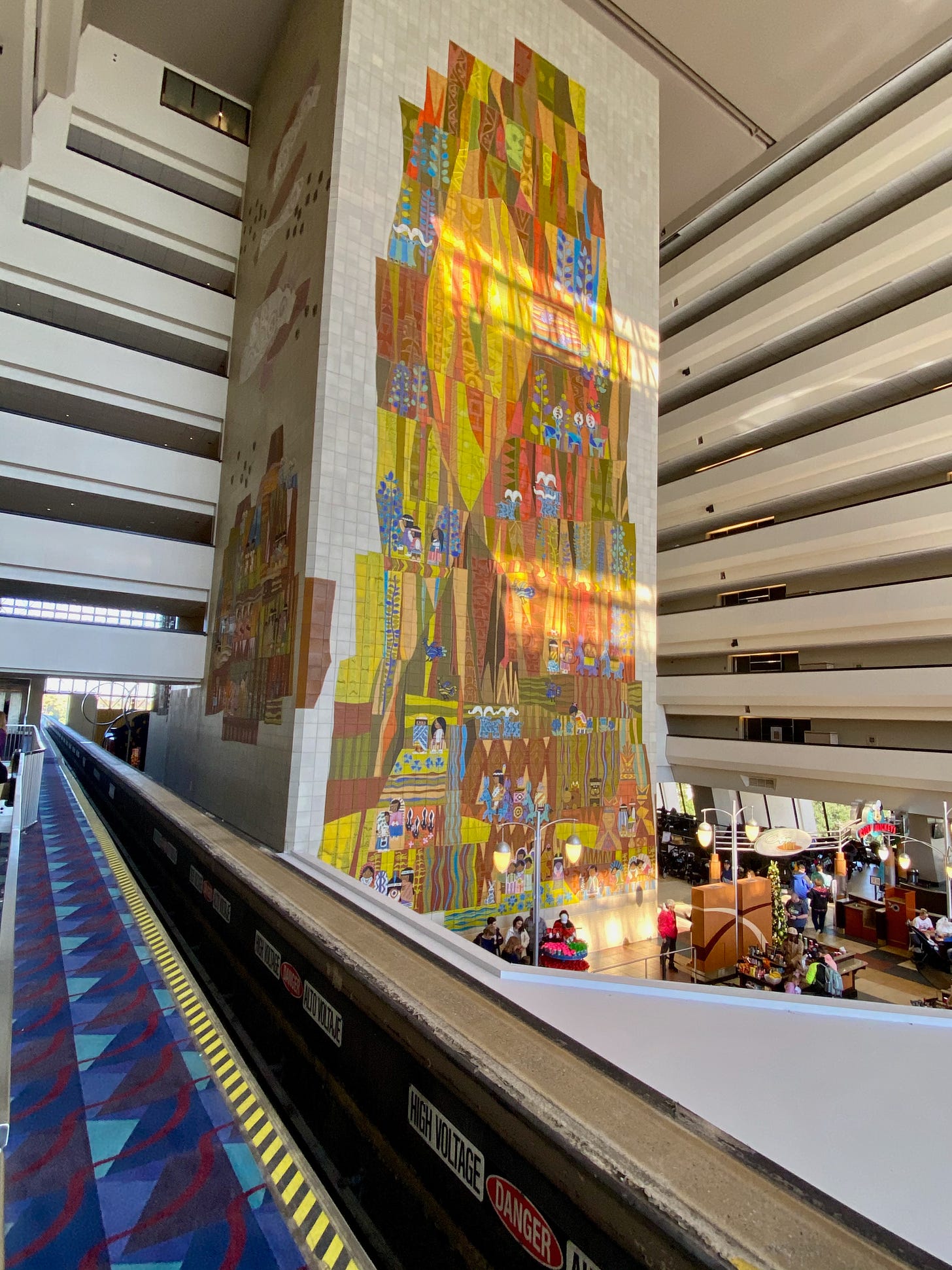 Lobby of Disney World Contemporary hotel with monorail track and mural