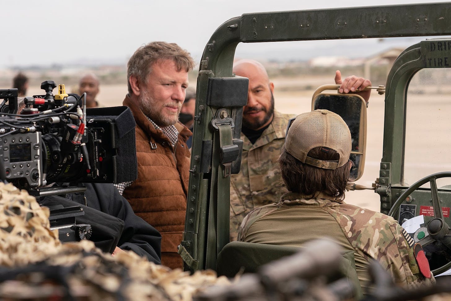 <p>Director Guy Ritchie, left, and actor Dar Salim who plays the Afghan interpreter abandoned by the US, on the set of ‘The Covenant’ </p>