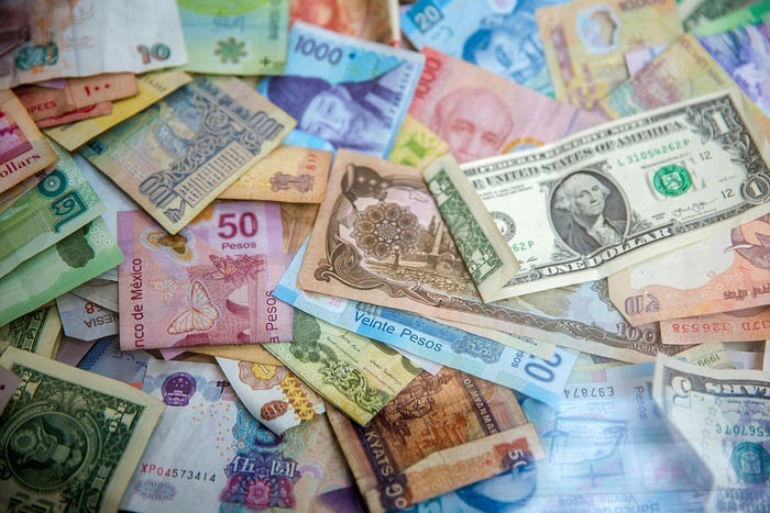 A pile of assorted currency from various countries around the globe. A pile of assorted currency from various countries around the globe.
