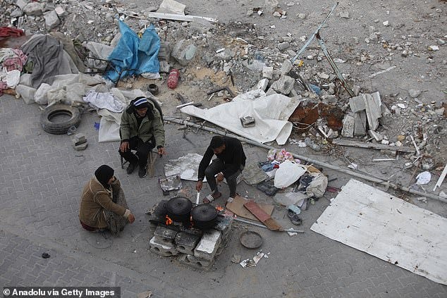 Palestinians try to continue their daily lives in rubble of buildings or their makeshift tents on the fifth day of Ramadan at the Bureij Refugee Camp in Gaza City, Gaza on March 05, 2025