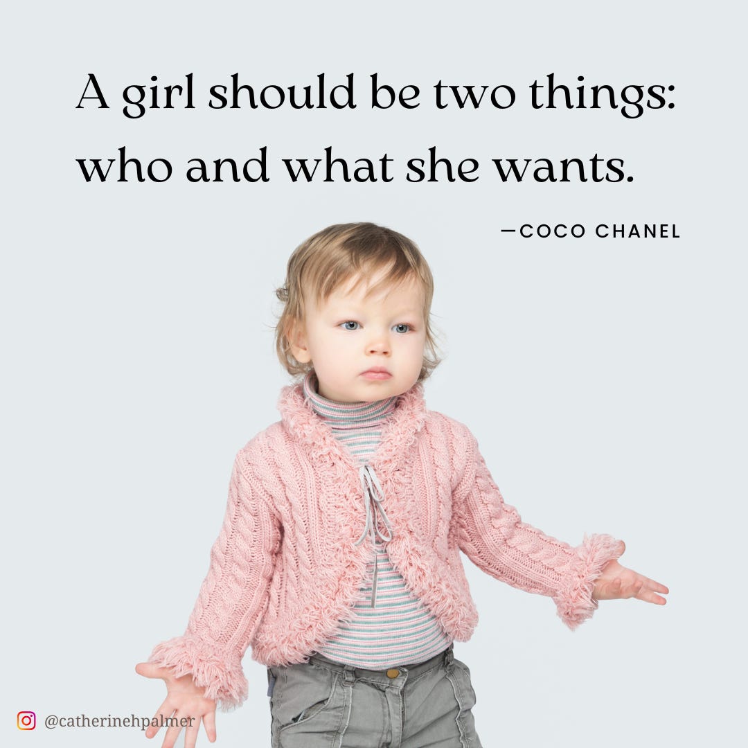 A toddler in a pink sweater against a grey backdrop. Coco Chanel quote.  girl should be two things: who and what she wants.