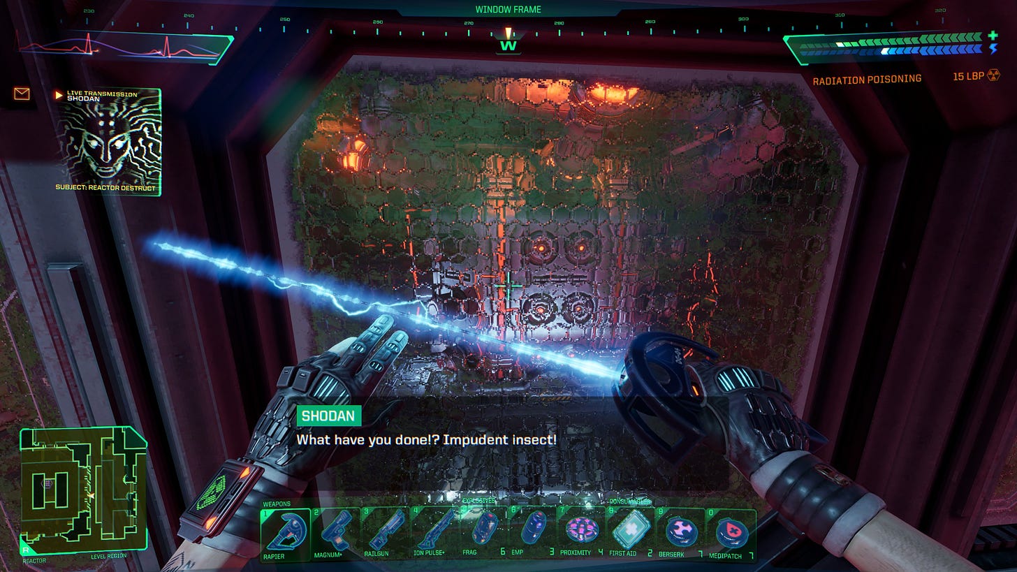 A screenshot of the game System Shock in its remake version of 2023. It shows the player in first-person perspective in front of a stylized glass panel overlooking the reactor and red alarm lights. The live transmission from SHODAN includes a caption that says: "What have you done!? Impudent insect!"