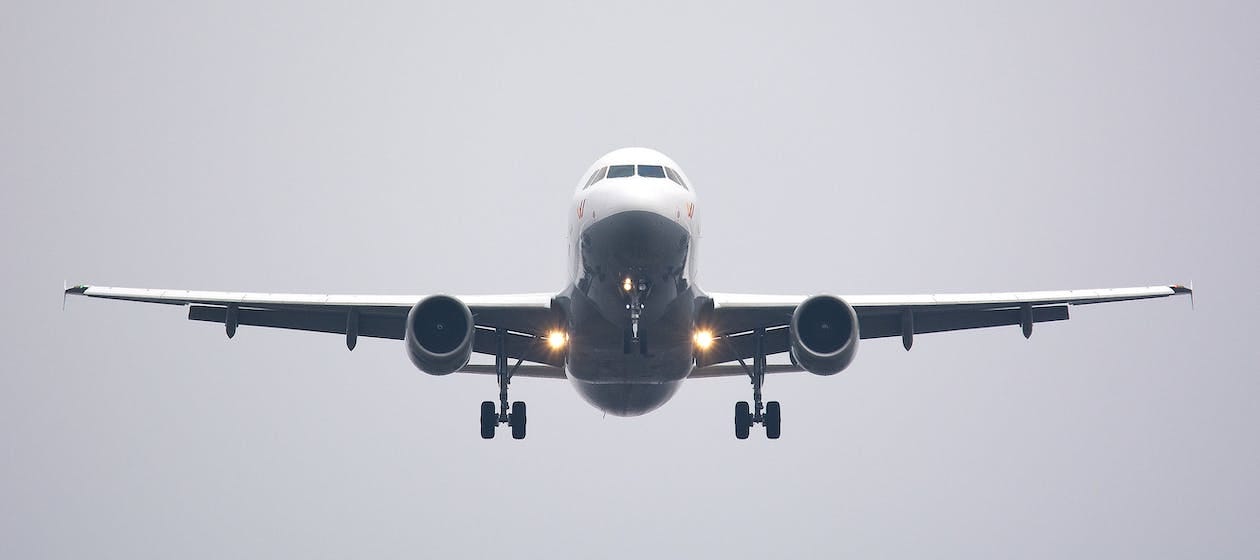 Free Time Lapse Photography of White Commercial Airplane Stock Photo