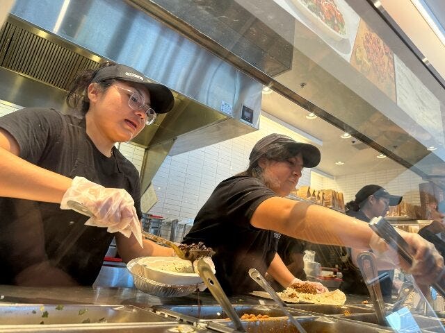 Chipotle workers on the line