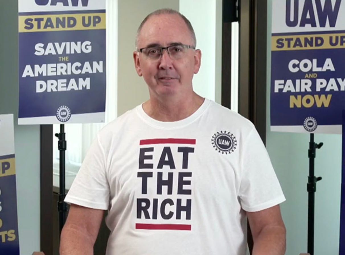 Shawn Fein wearing an Eat The Rich t-shirt