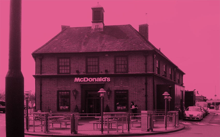 A branch of McDonald's in an old pub building on a road junction in Eltham, South London.