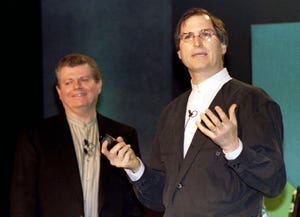 Steve Jobs with Gil Amelio, onstage at MacWorld 1997.