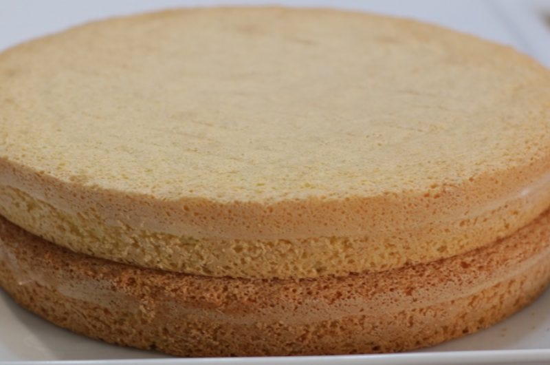 easy 3-ingredient sponge cake layered on a white plate