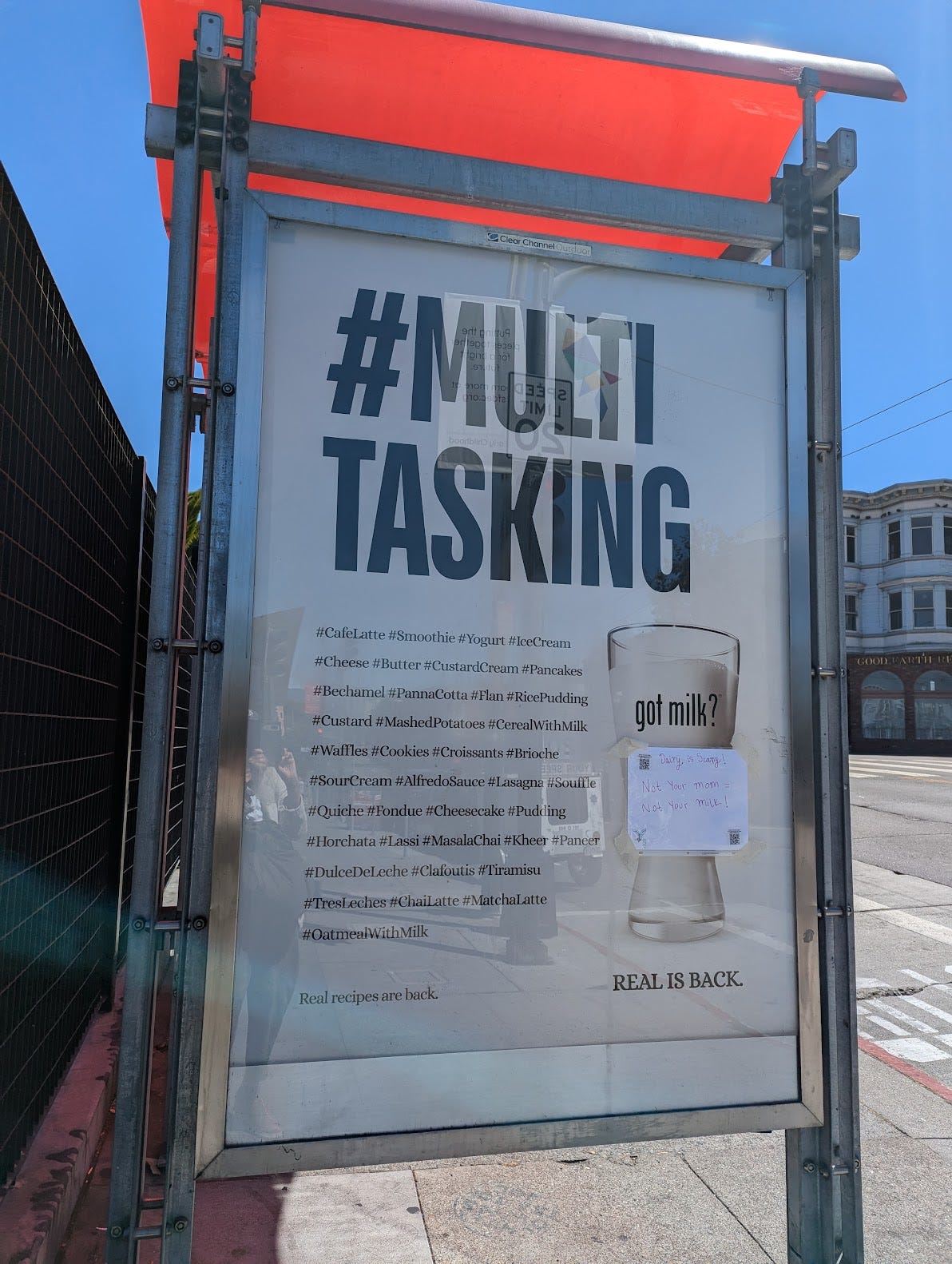 San Francisco bus-shelter ad for California Milk Processor Board. The headline reads #Multi Tasking. The copy consists of a long list of recipe names preceded by hashtag symbols. A small piece of paper has been taped under the GOT MILK? slogan.