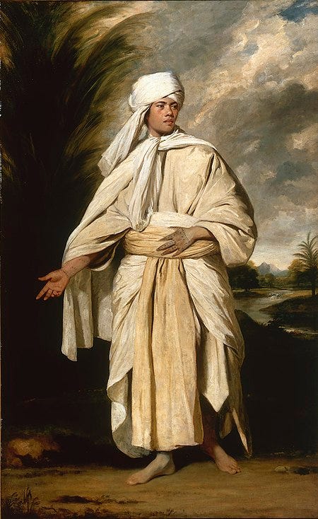 A portrait of a Polynesian man dressed in a turban and flowing robes, adopting a classical pose reminiscent of Roman statuary