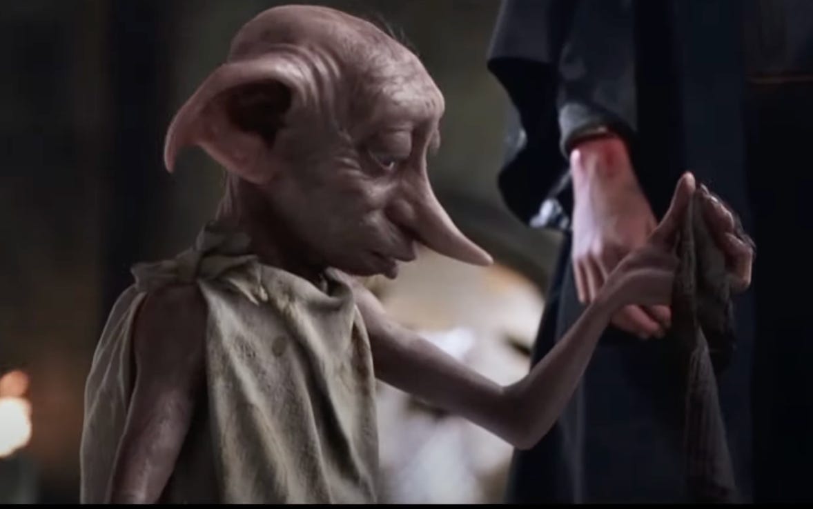 Dobby from Harry Potter holding a sock.