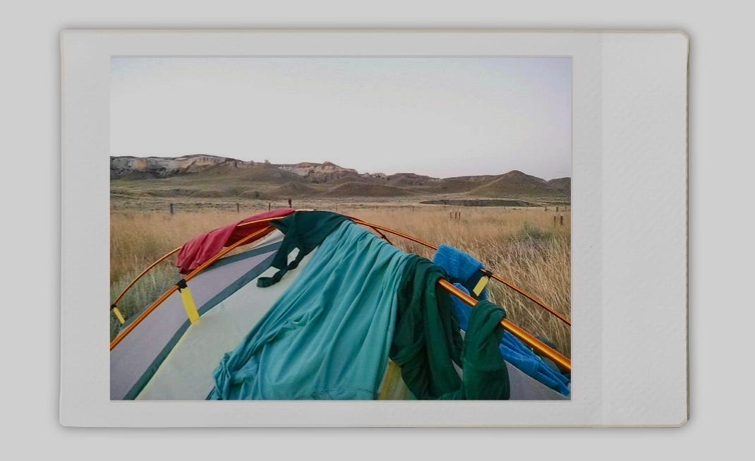 Hanging laundry on the top of a tent to dry