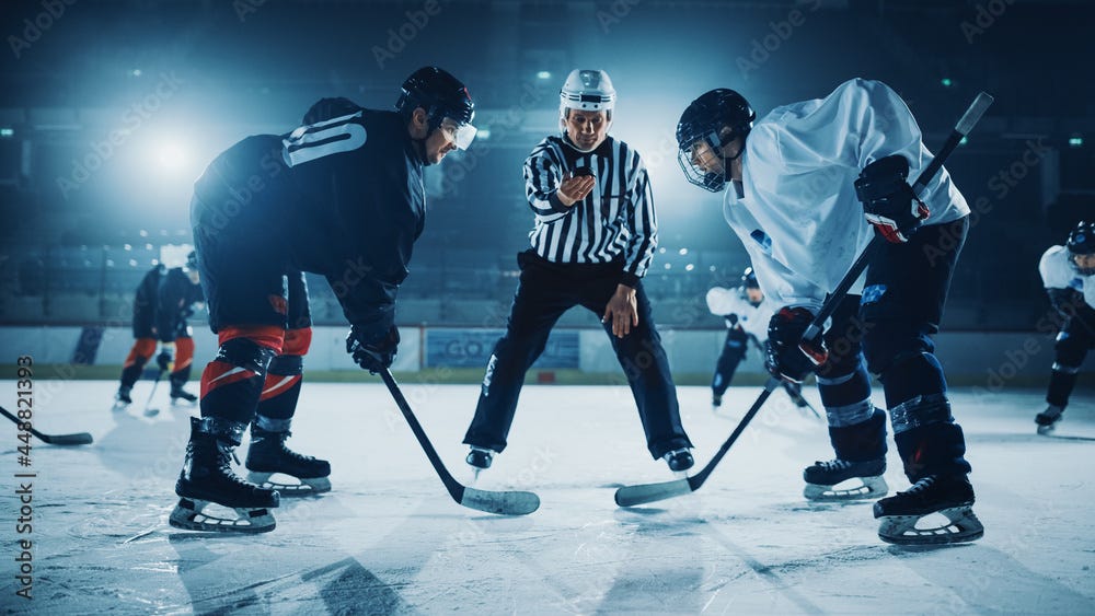 Ice Hockey Rink Arena Game Start: Two Players Brutal Face off, Sticks  Ready, Referee is Going to Drop the Puck, Athletes Ready to Fight. Intense  Game Wide of Energy Competition, Speed. Stock