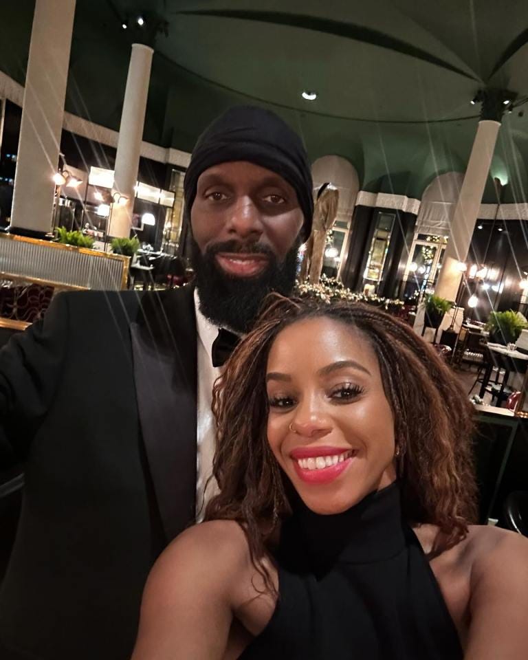 Couple in formal wear at a restaurant.