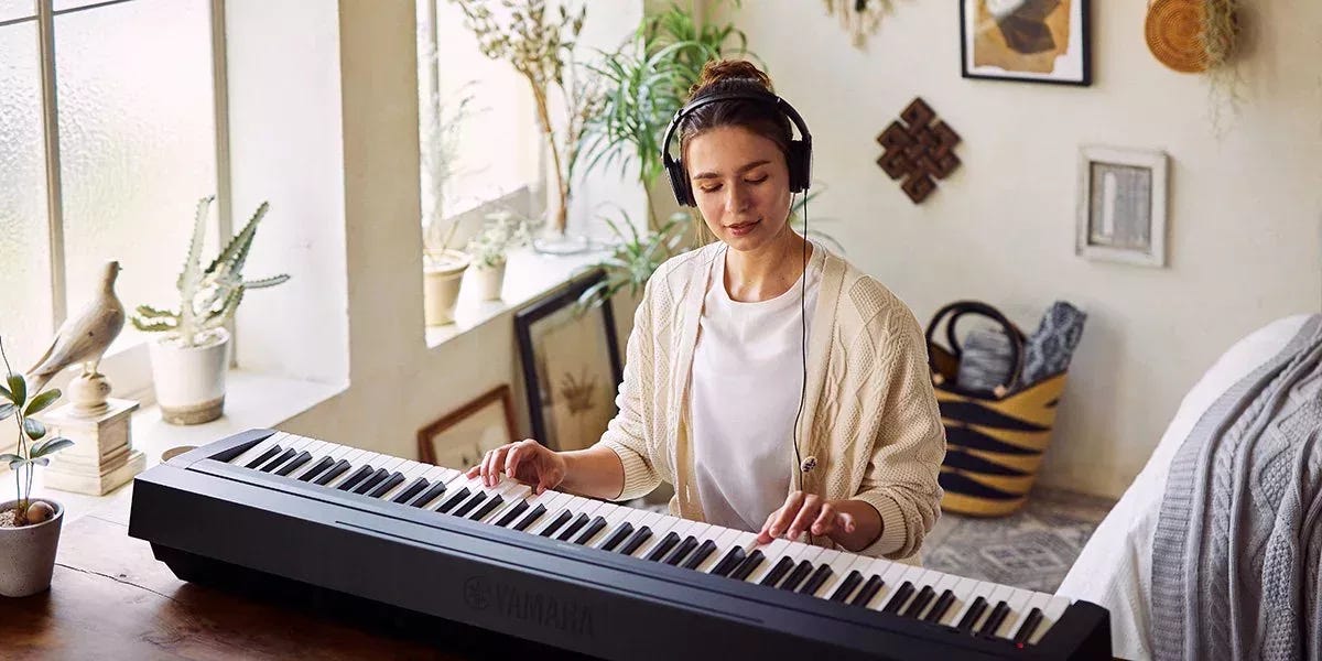 woman playing yamaha p45