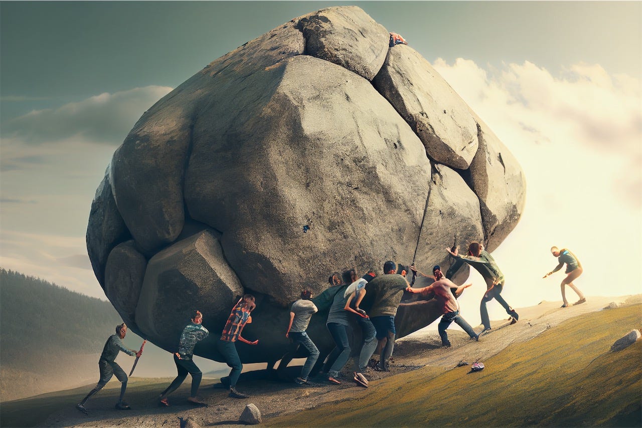 A group of people pushing a big rock up a hill