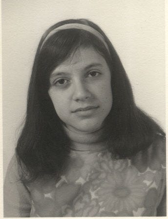 Long-haired teen girl looking sad