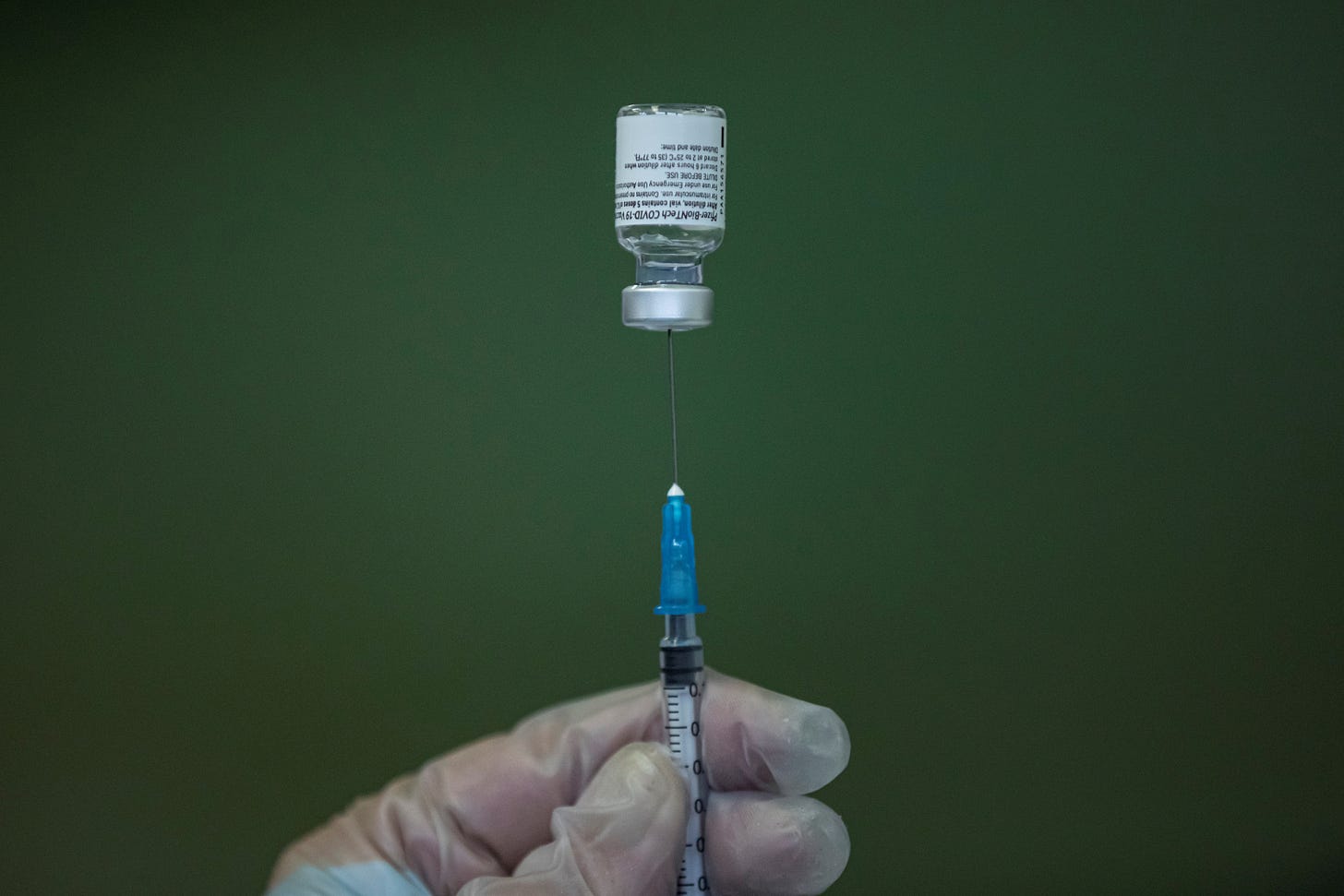 A medical worker fills a syringe with Pfizer-BioNTech vaccine in Nis, Serbia