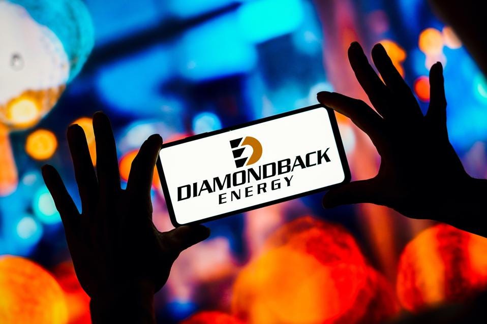 In this photo illustration, the Diamondback Energy logo is...