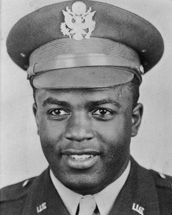 Black and white photo of African American man in World War Two officer's uniform and hat.