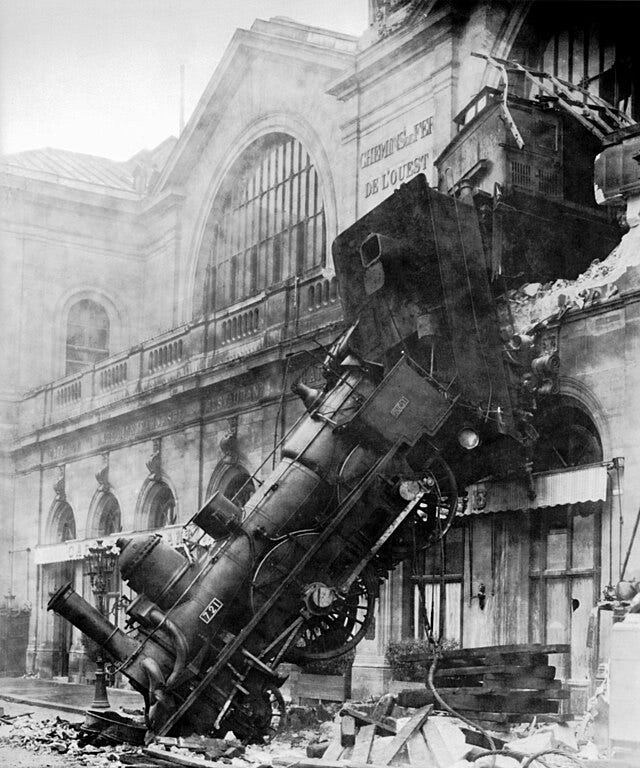 Photo of a train falling out the front of a building in Paris in 1895