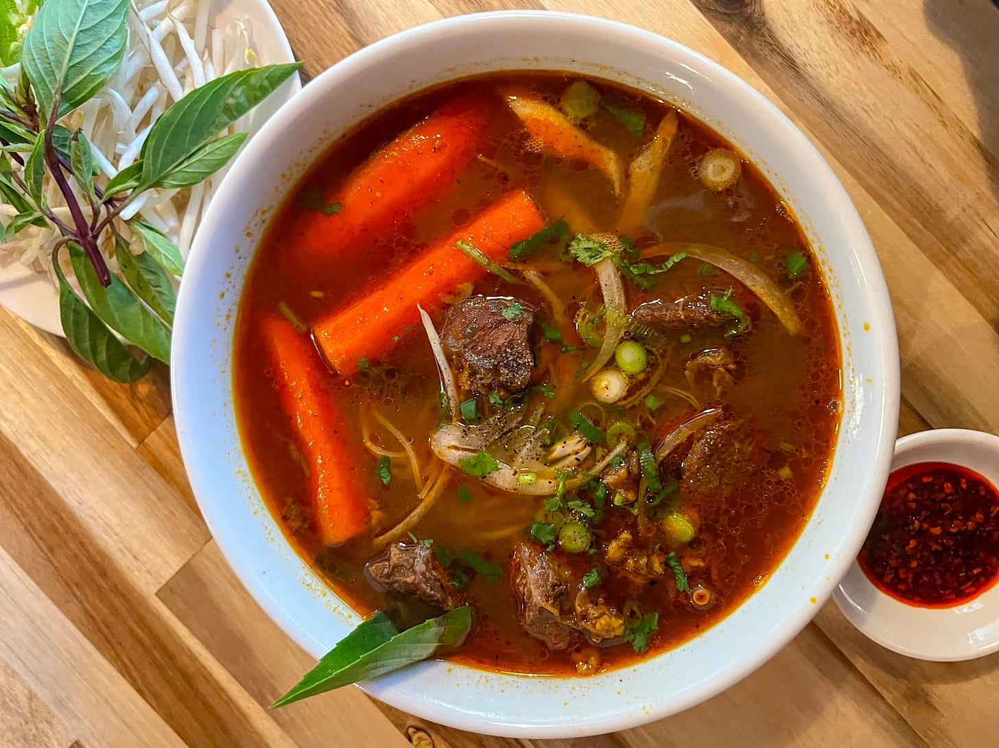 Hủ tiếu bò kho and accompaniments