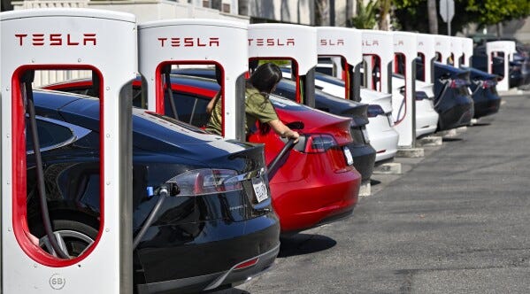 Tesla plans to lay off 10% of workforce | AP News