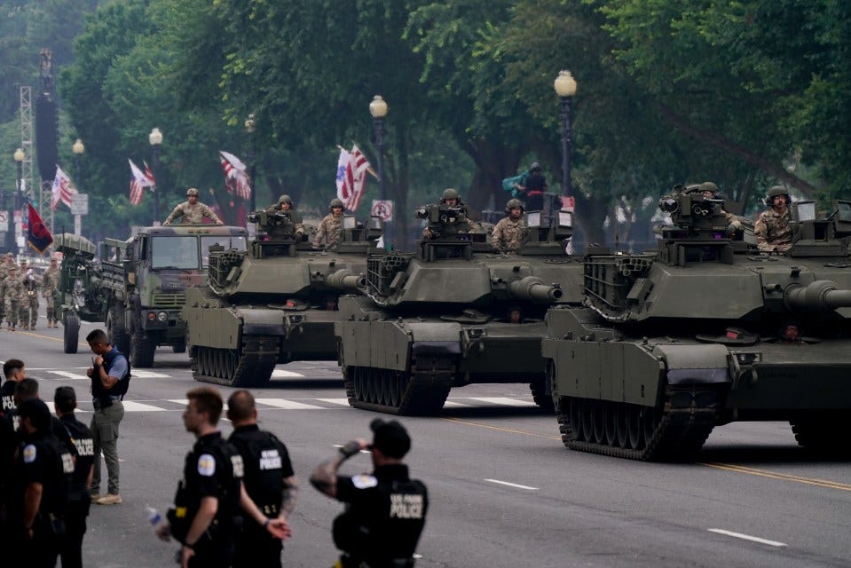 Military tanks in a parade.