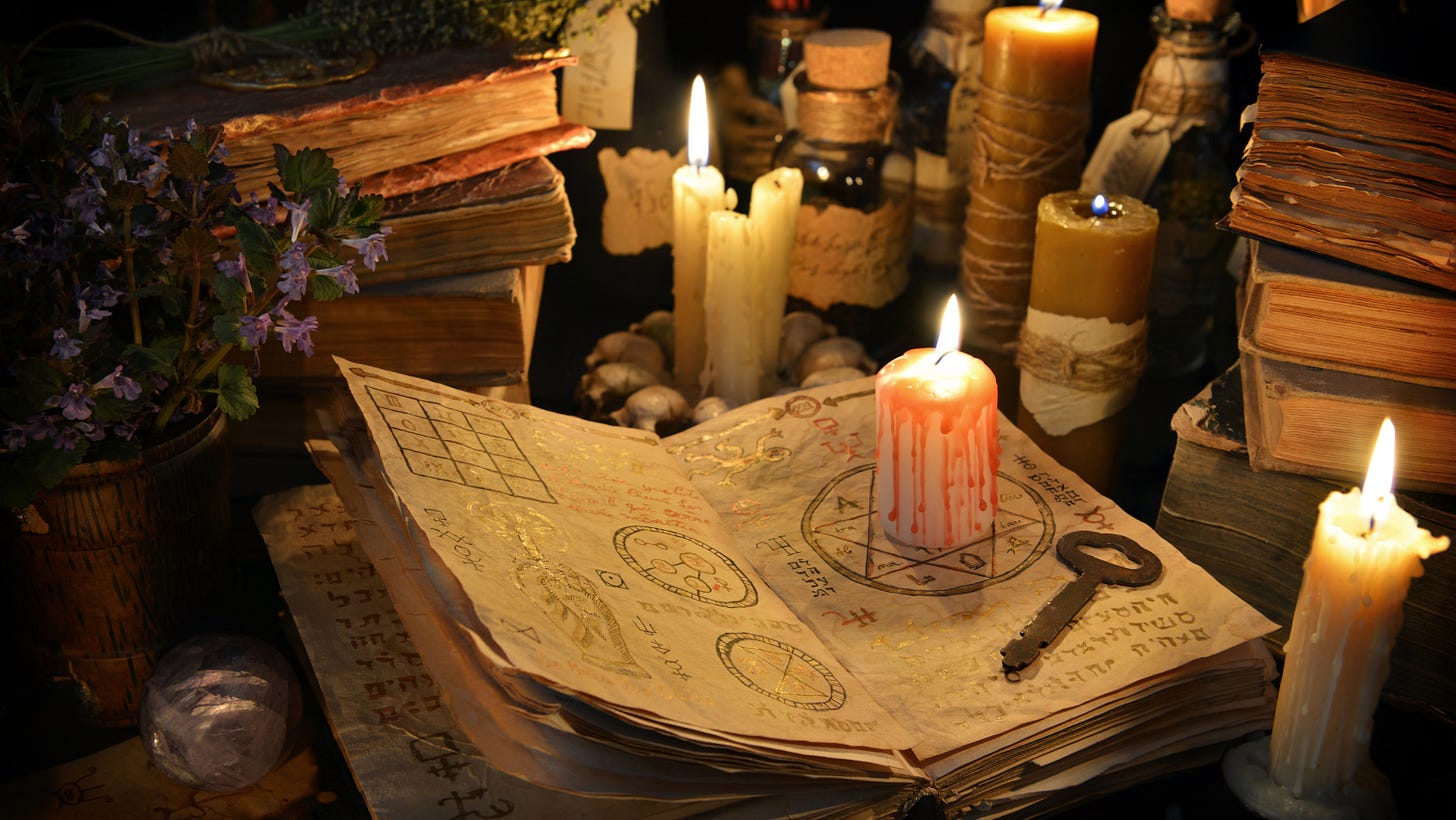The image shows a lighted candle on an ancient book. An ancient key is lying on the open book and the surroundings are mystical. The image is part of the article titled “Is it possible to predict the future?” published on https://rationalastro.org. The article is written by Anish Prasad who is an IIT Engineer, an IPS officer and passionate Astro-Spirituality researcher and practitioner.