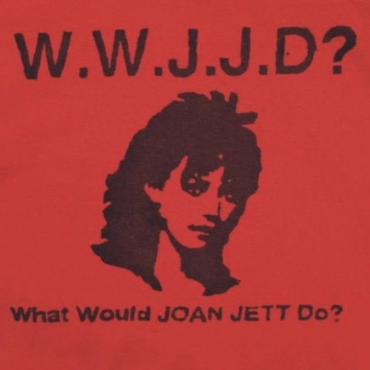 This may contain: a red t - shirt with the words what would joan jet do?