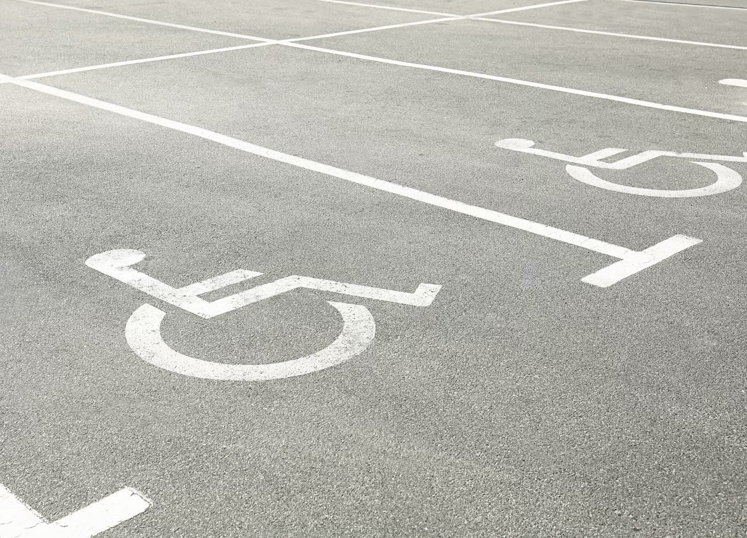 Black and white photo of a row of accessible parking spaces