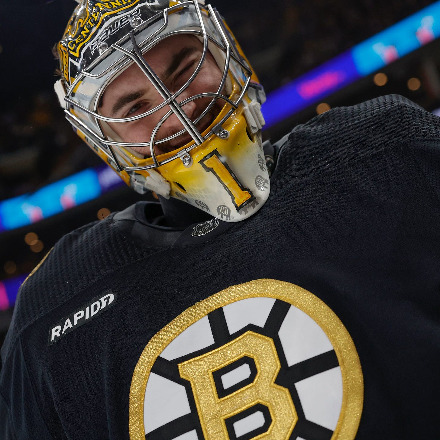 A close up of Jeremy Swayman winking into the camera.