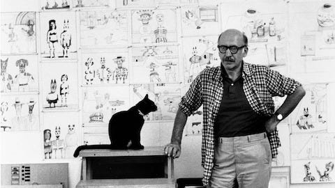 Saul Steinberg with cat in his Amagansett, Long Island, studio, 1974.