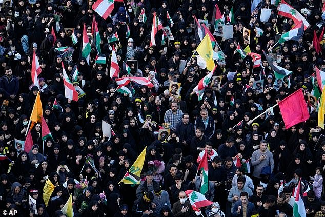 Mourners attend a rally commemorating slain Hezbollah leader Hassan Nasrallah at Felestin (Palestine) Sq. in downtown Tehran, Iran, Monday, Sept. 30, 2024