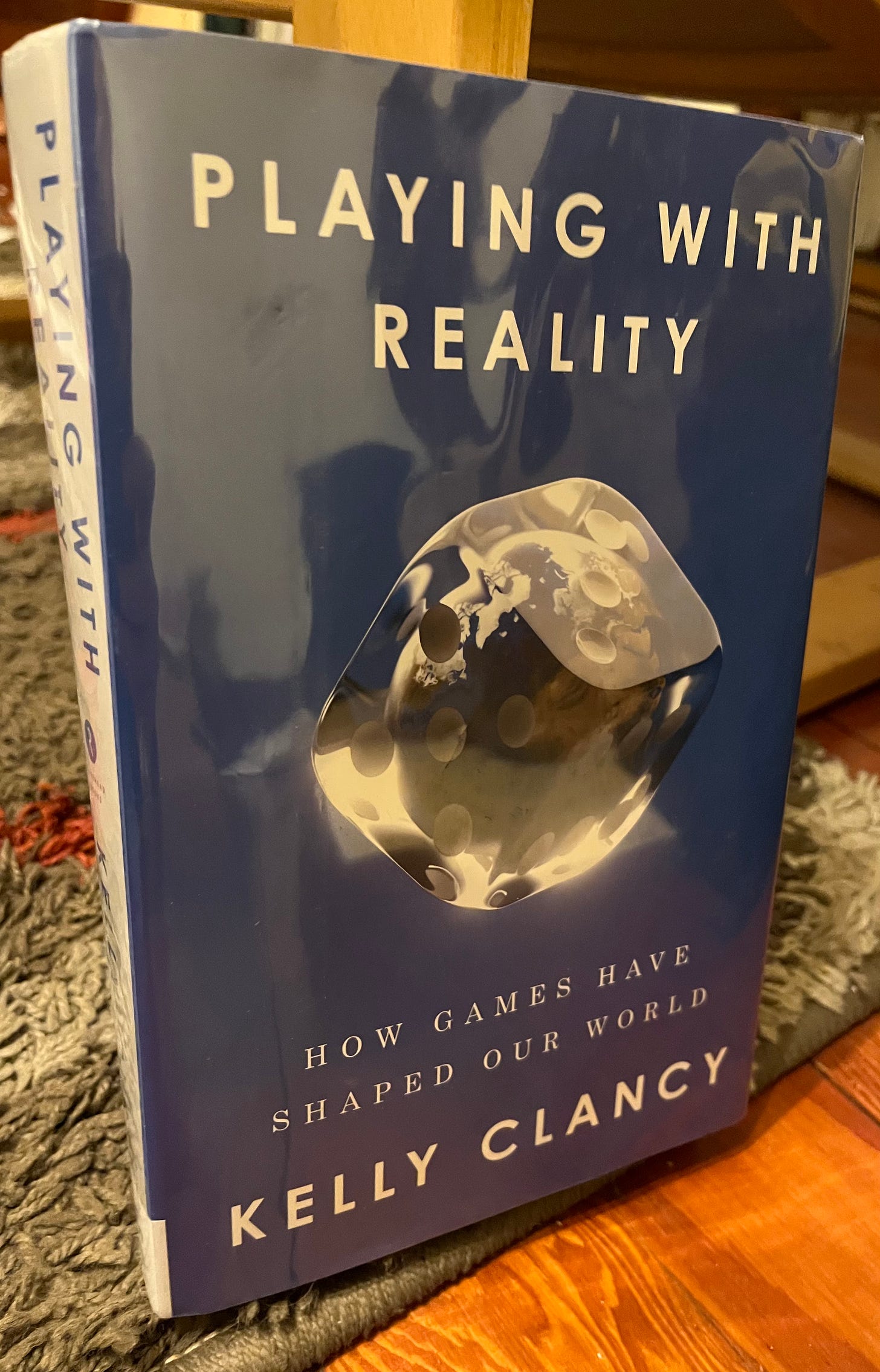 Cover of “Playing With Reality” by Kelly Clancy