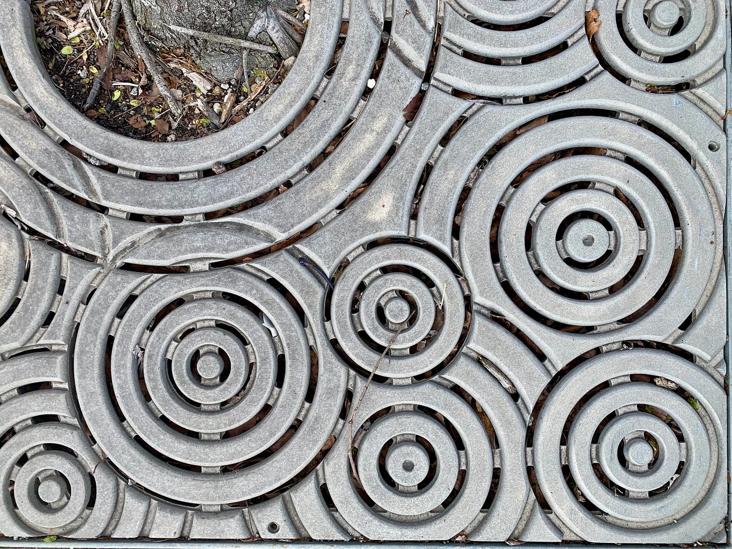 a curious pattern in a metal grate that reminded me of boombox speakers!