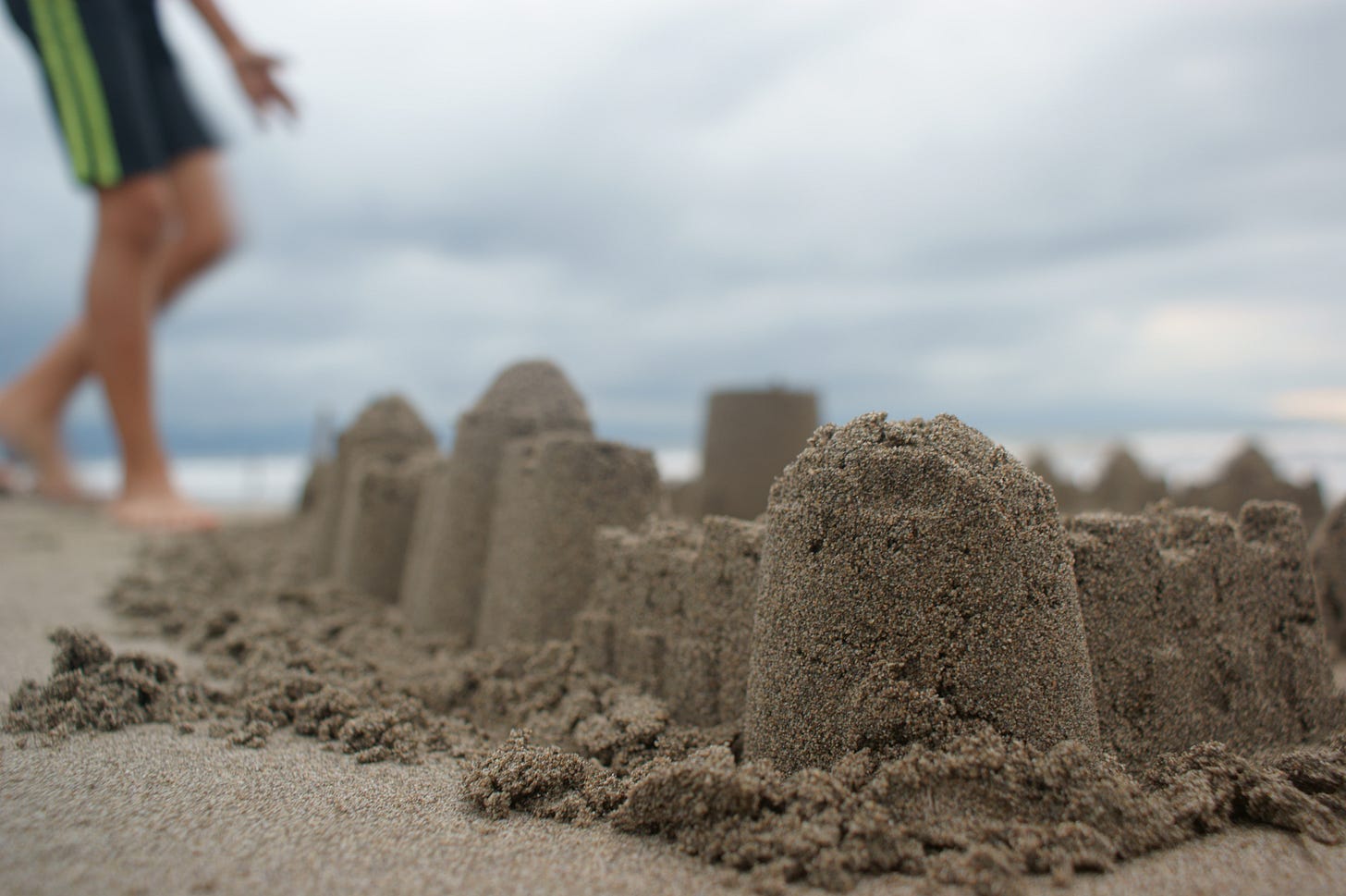 Person Standing Near Sand Castle · Free Stock Photo Person Standing Near Sand Castle · Free Stock Photo