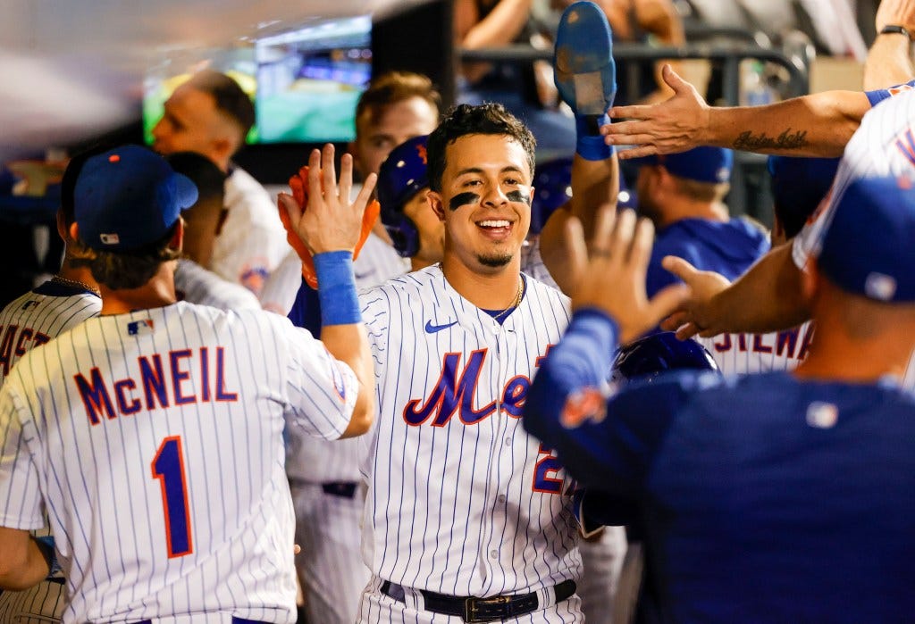 Mark Vientos celebrates with teammates after belting a two-run homer in the sixth inning of the Mets' victory.