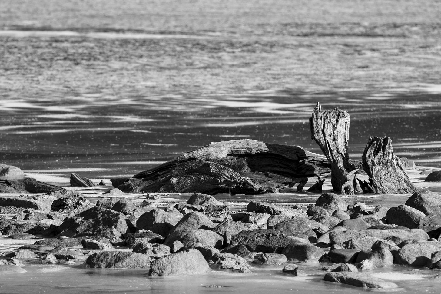 Black and white photo of a frozen lake