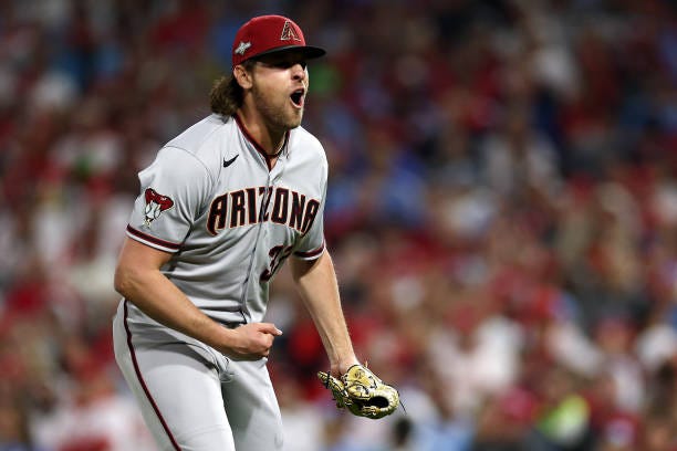 Kevin Ginkel of the Arizona Diamondbacks reacts after striking out J.T. Realmuto of the Philadelphia Phillies during the eighth inning in Game Seven...