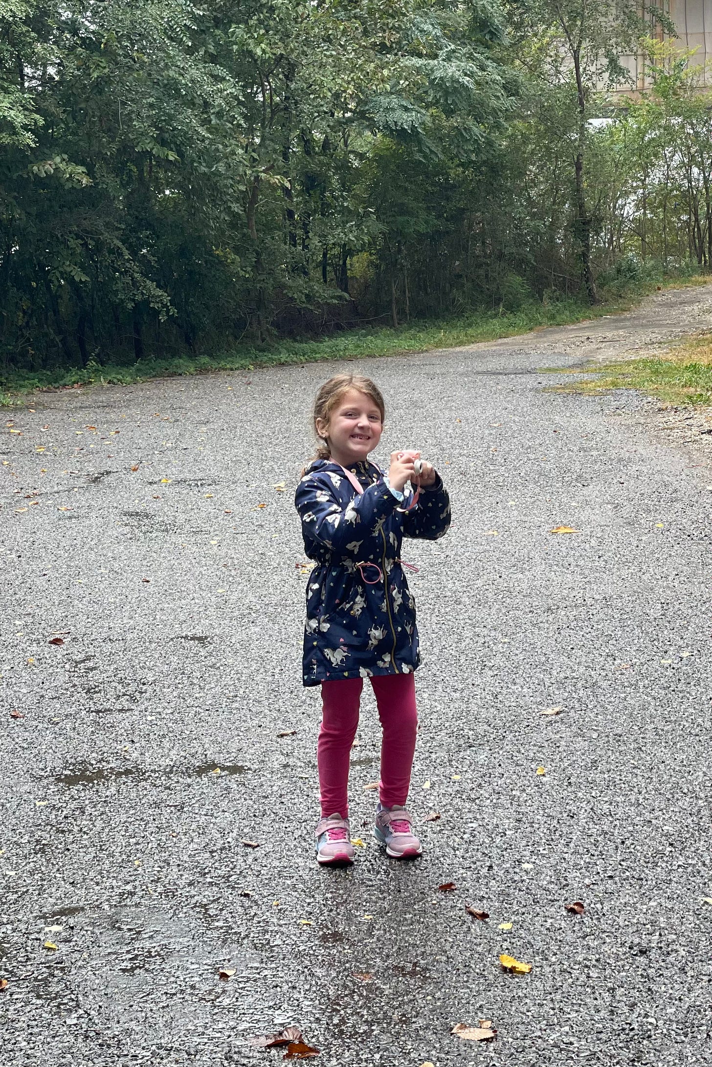 Little girl taking photos