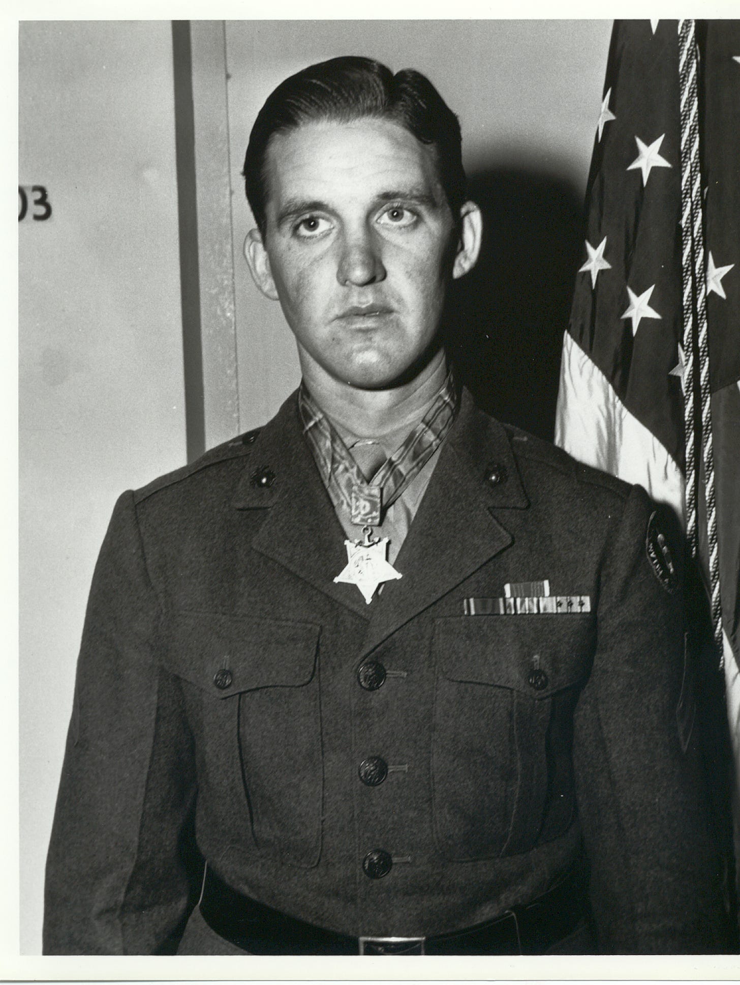 Headshot of Bush in uniform. He is wearing his Medal.