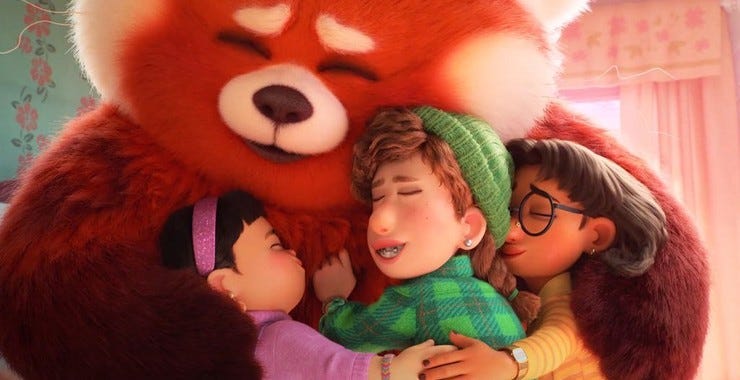 A frame from Turning Red where the main character as a giant red panda, Mei, hugs her three friends.