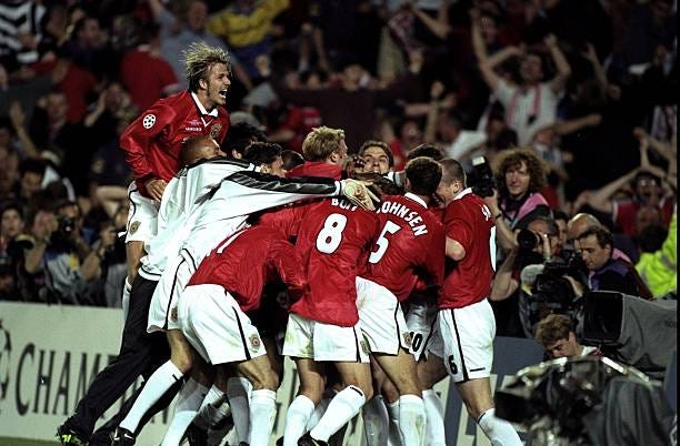 Manchester United players celebrate Ole Gunnar Solskjaer's goal in the European Champions League Final against Bayern Munich in the Nou Camp Stadium,...