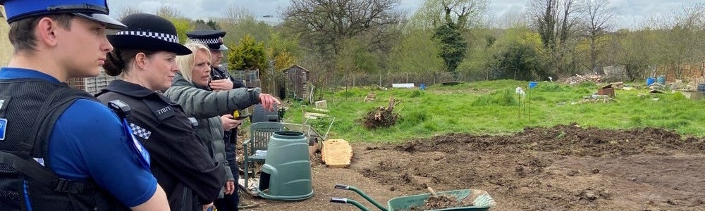 Carly Burd shows Harlow Community Policing Team officers the damage caused at Canons Gate Allotments