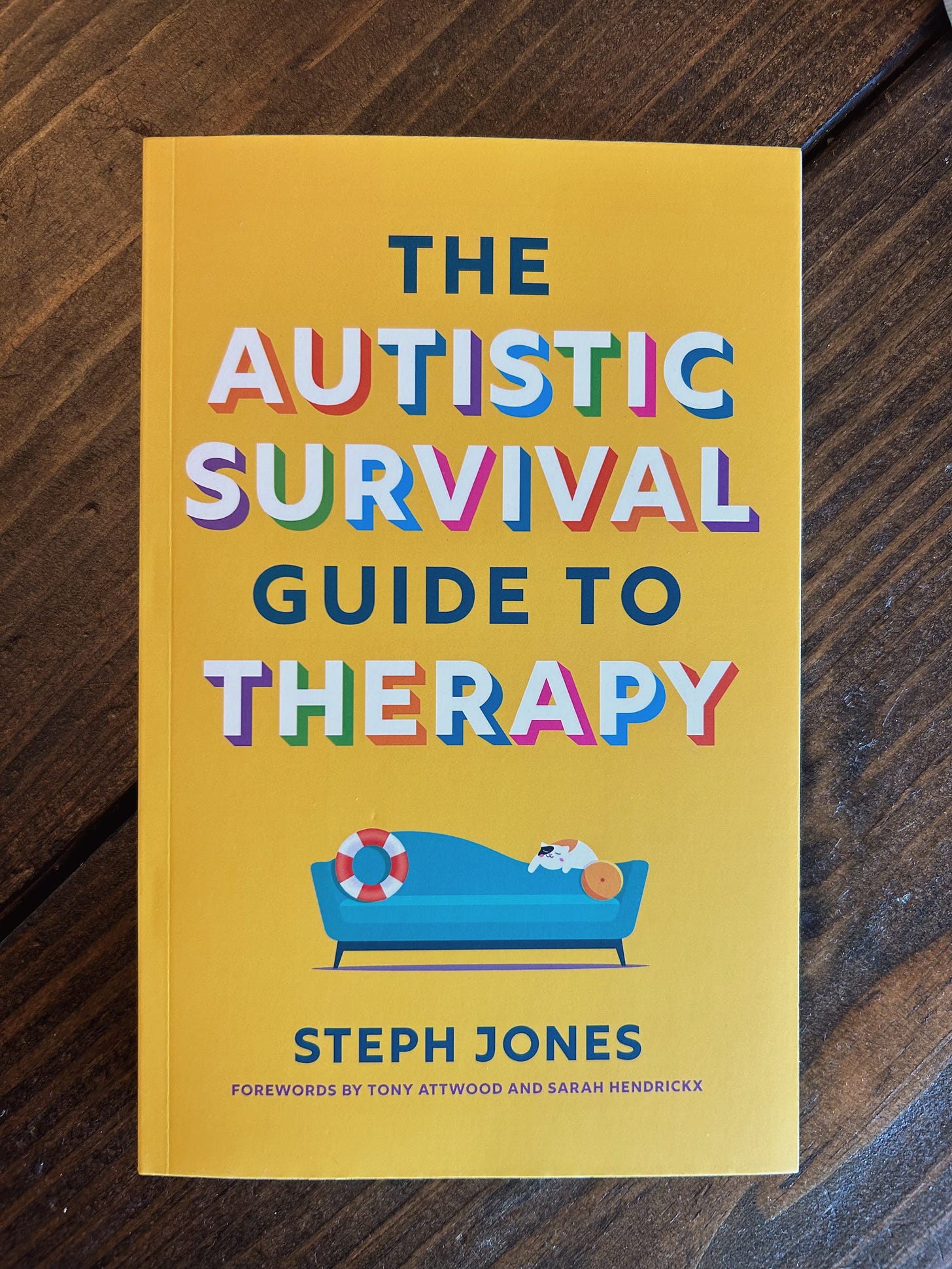 Yellow paperback The Autistic Survival Guide to Therapy by Steph Jones